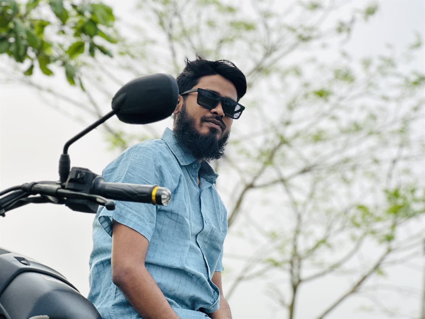 RH Razu on his motorbike
